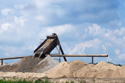 Low angle view of construction site against sky