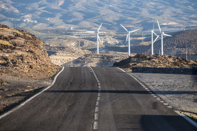 Spain, tenerife, empty road and windpark