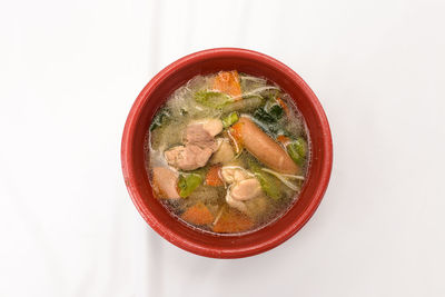 High angle view of soup in bowl against white background