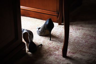 High angle view of high heels on carpet