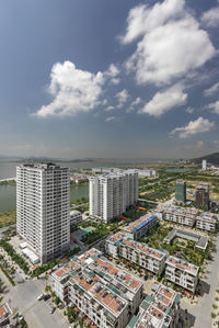 High angle view of buildings in city against sky