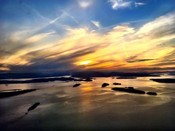 Scenic view of sea against sky at sunset