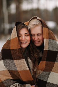 Portrait of a smiling young woman in winter