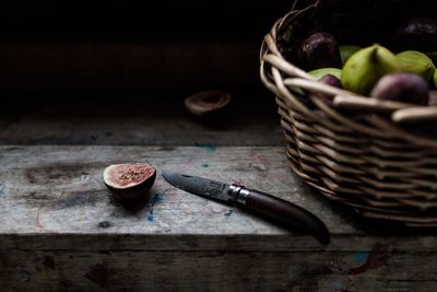 Close-up of fruits in basket on table