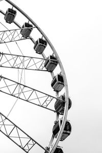 Low angle view of ferris wheel against clear sky
