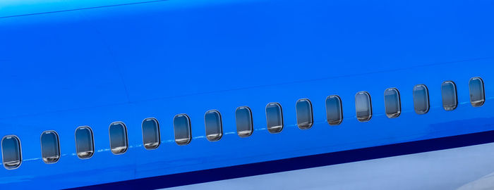 Low angle view of cables against clear blue sky