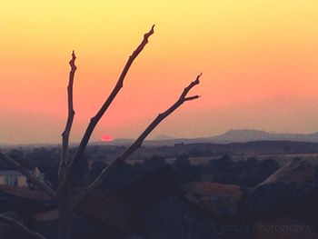 Scenic view of landscape against sky during sunset