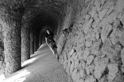 Woman standing in corridor