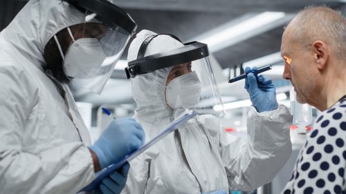 Side view of doctor examining patient in hospital