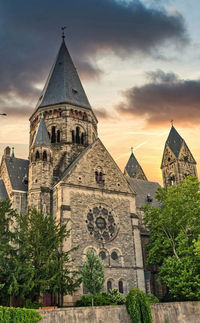 Exterior of temple against sky during sunset