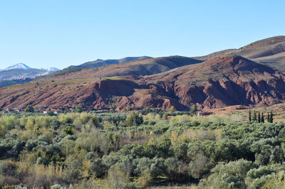Scenic view of mountains against clear blue sky