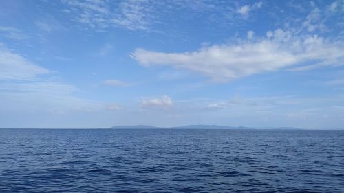 Scenic view of sea against blue sky