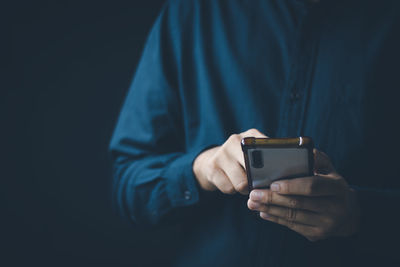 Social media technology concept, men's hands using smartphones to login social media, work from home