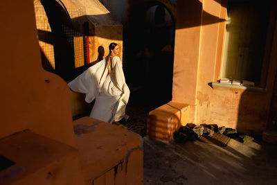 Side view of woman in historic building