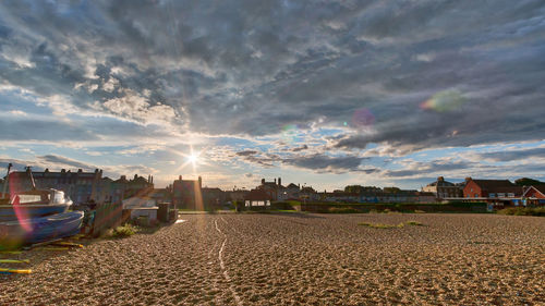 View of houses against sky at sunset