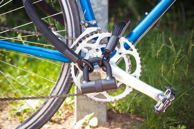 Close-up of bicycle wheel on field