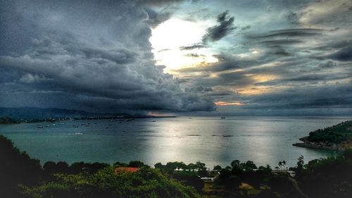 Scenic view of sea against storm clouds