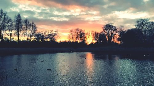 Scenic view of lake against sky during sunset