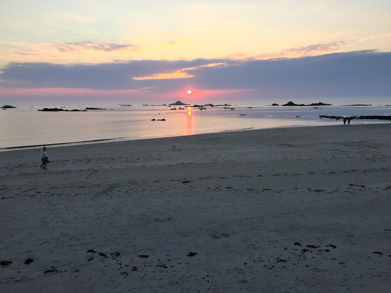 SCENIC VIEW OF BEACH DURING SUNSET