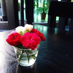 Close-up of red flowers in vase