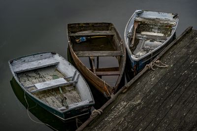 Abandoned boat moored in water