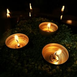 High angle view of illuminated candles