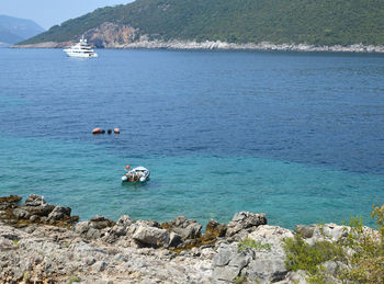 High angle view of sailboats on sea shore