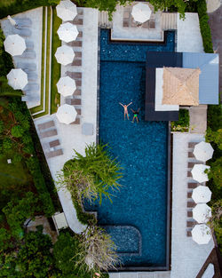 High angle view of swimming pool by building