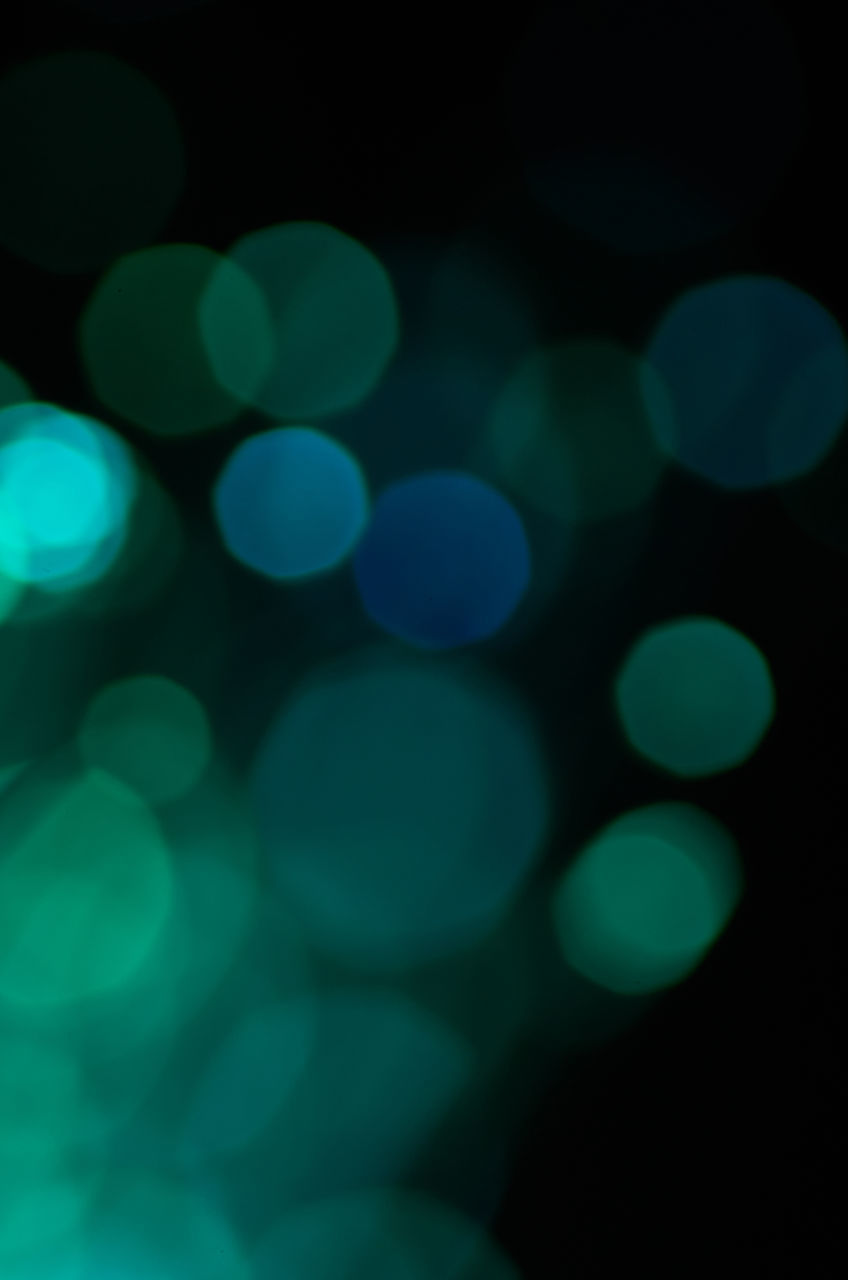 DEFOCUSED IMAGE OF LIGHTS AT NIGHT