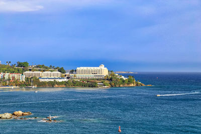 Scenic view of sea against blue sky