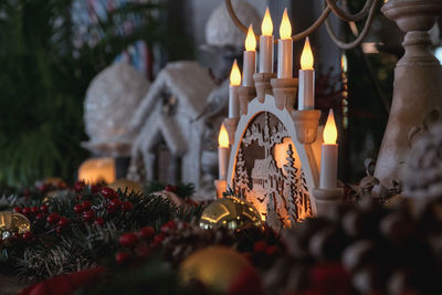 Illuminated candles on temple