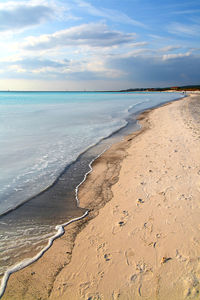 View of calm beach against the sky