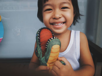 Portrait of happy girl holding ice cream
