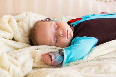 Cute baby sleeping in bed