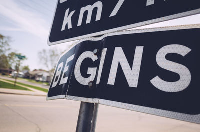 Close-up of road sign on street