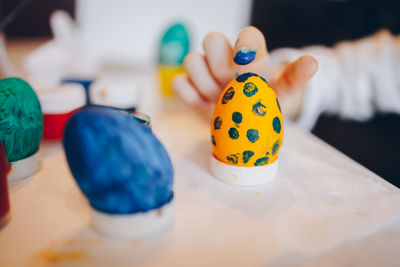 Close-up of multi colored eggs on table