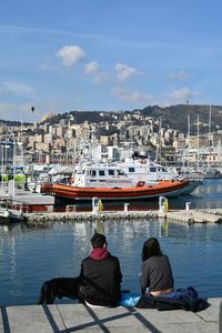 Boats moored at harbor