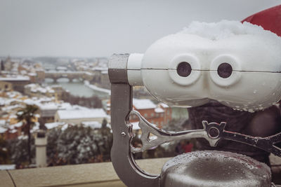 Close-up of coin-operated binoculars against blurred background