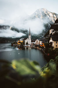 River amidst buildings against sky