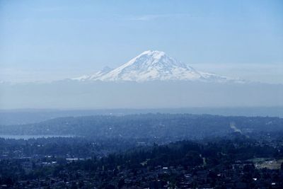 Scenic view of snow covered mountains against sky