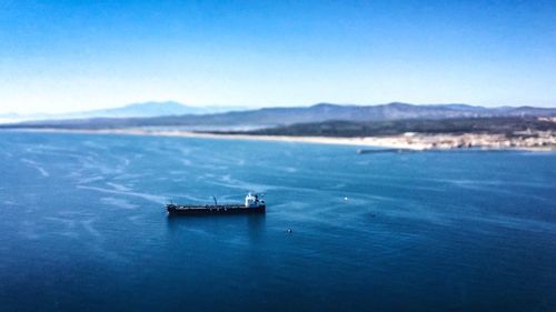 Scenic view of sea against blue sky