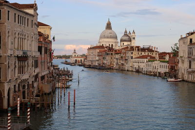 Canal amidst buildings in city