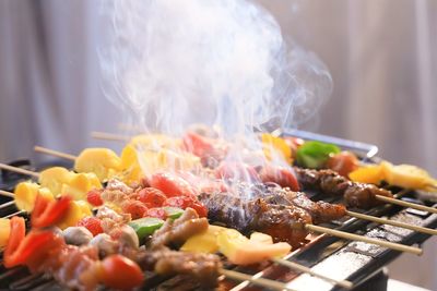 Close-up of meat on barbecue grill