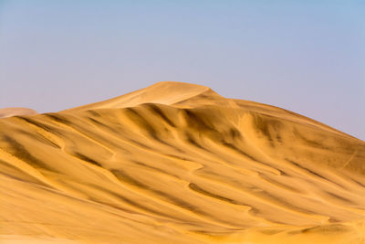 Scenic view of desert against clear sky