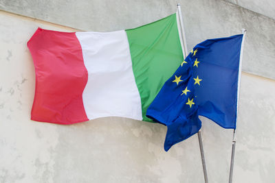 Flags waving against wall