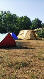 Tent on field against sky