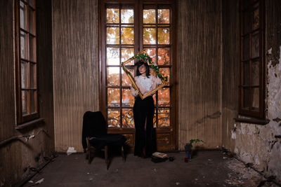 Full length of man standing in abandoned building