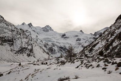 Scenic view of snowcapped mountains against sky