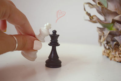 Low angle view of person playing chess