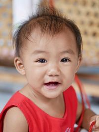 Portrait of smiling baby girl at home